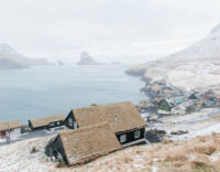The village of Bøur on Vágar island with a view Tindhólmur and Gáshólmur.