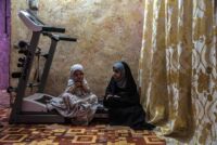 Tiktum (right) and her cousin Simsim dressed up with abayas and now play the grown ups sitting on a treadmill. Simsim, 4, lives in Babel. Her family came to visit during a religious holiday.
Chibayish, Iraq, 11/09/2019