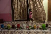 Fatma walks across the "diwaniyah" (reception room) in her maternal grandmother's house, where the "table" has been set for Iftar, the meal that breaks the fast of Ramadan.
Chibayish, Southern Iraq, 10/05/2019
