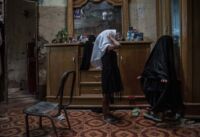 Fatma (left) and Tiktum dress up and admire themselves in the mirror. In Chibayish, some girls as young as 6 wear headscarves. In a couple of years, Fatma will have to wear a hijab.
Chibayish, Iraq, 15/10/2018
